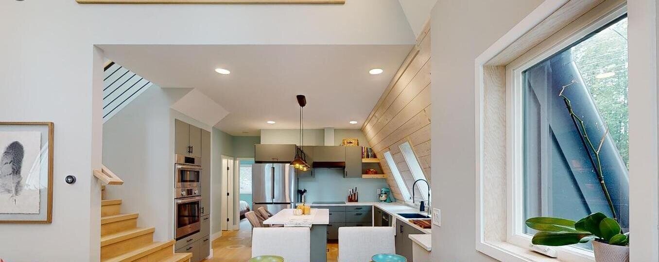 Open kitchen & dining with custom concrete countertop